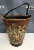 A 19th Century leather fire bucket of tapered form decorated with transfer of Royal coat of arms