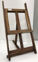 A small mahogany easel 64.