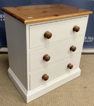 A modern painted and polished pine dwarf chest with three drawers,