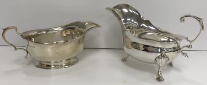 Two silver sauce boats, one on oval foot, the other on hoof feet, 9.