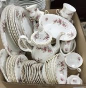 A Royal Albert Lavender Rose part dinner/tea service comprising tea pot, cream jug and sugar bowl,