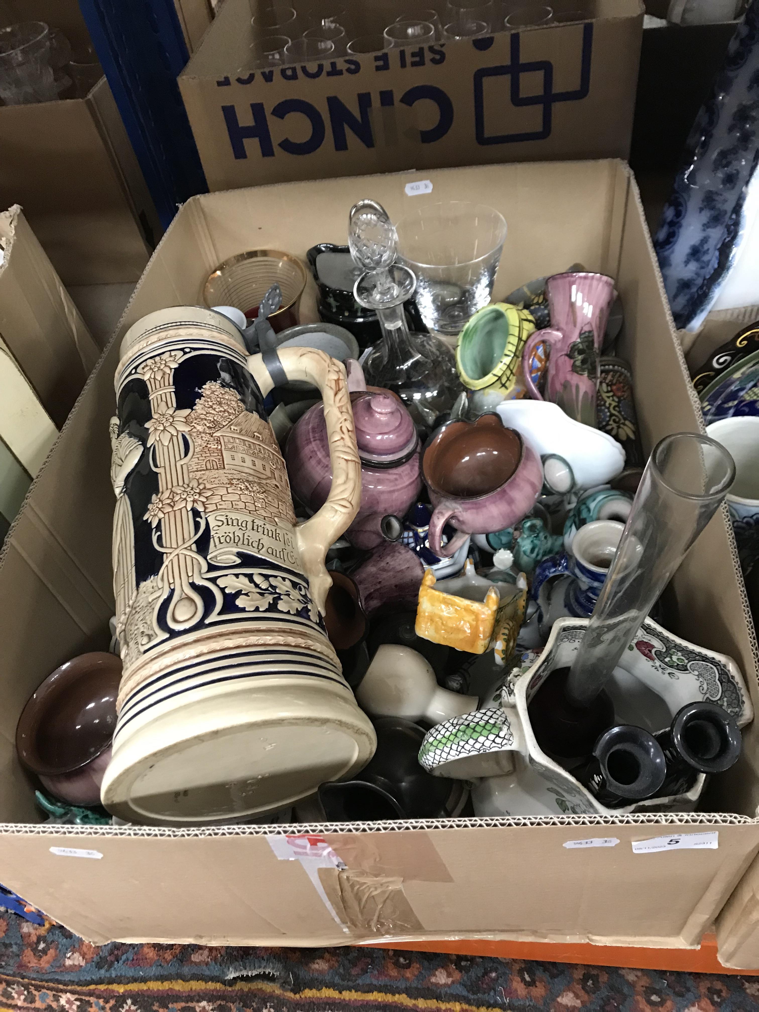 Two boxes of assorted decorative china to include large beer stein, donkey salts, decorative plates,