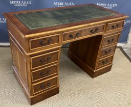 A modern reproduction yew wood double pedestal desk in the Georgian style,