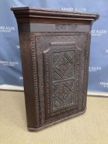 WITHDRAWN An 18th Century oak hanging corner cupboard,