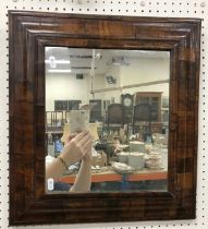 An early 18th Century walnut cushion framed wall mirror of rectangular form 45 cm wide x 49 cm high