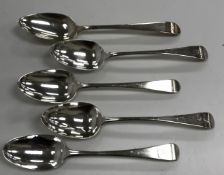 A collection of five silver "Hanoverian" pattern table spoons, various dates and makers,