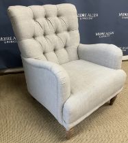 A John Lewis pale grey upholstered button back scroll arm chair on turned legs 73 cm wide x 90 cm