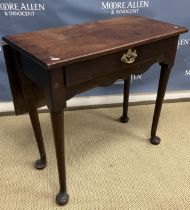 An 18th Century mahogany tea table the single piece top with rear drop flap over a single drawer