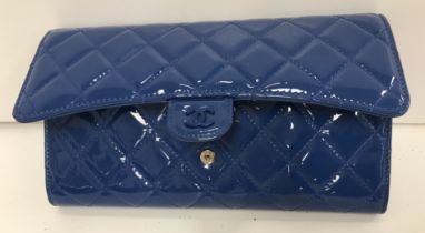 A patent blue Chanel travel clutch bag with passport holder, card holder etc, authenticity card no.