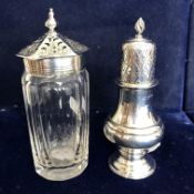 A George V silver baluster pepper in the 18th Century manner with pierced domed top and flaming