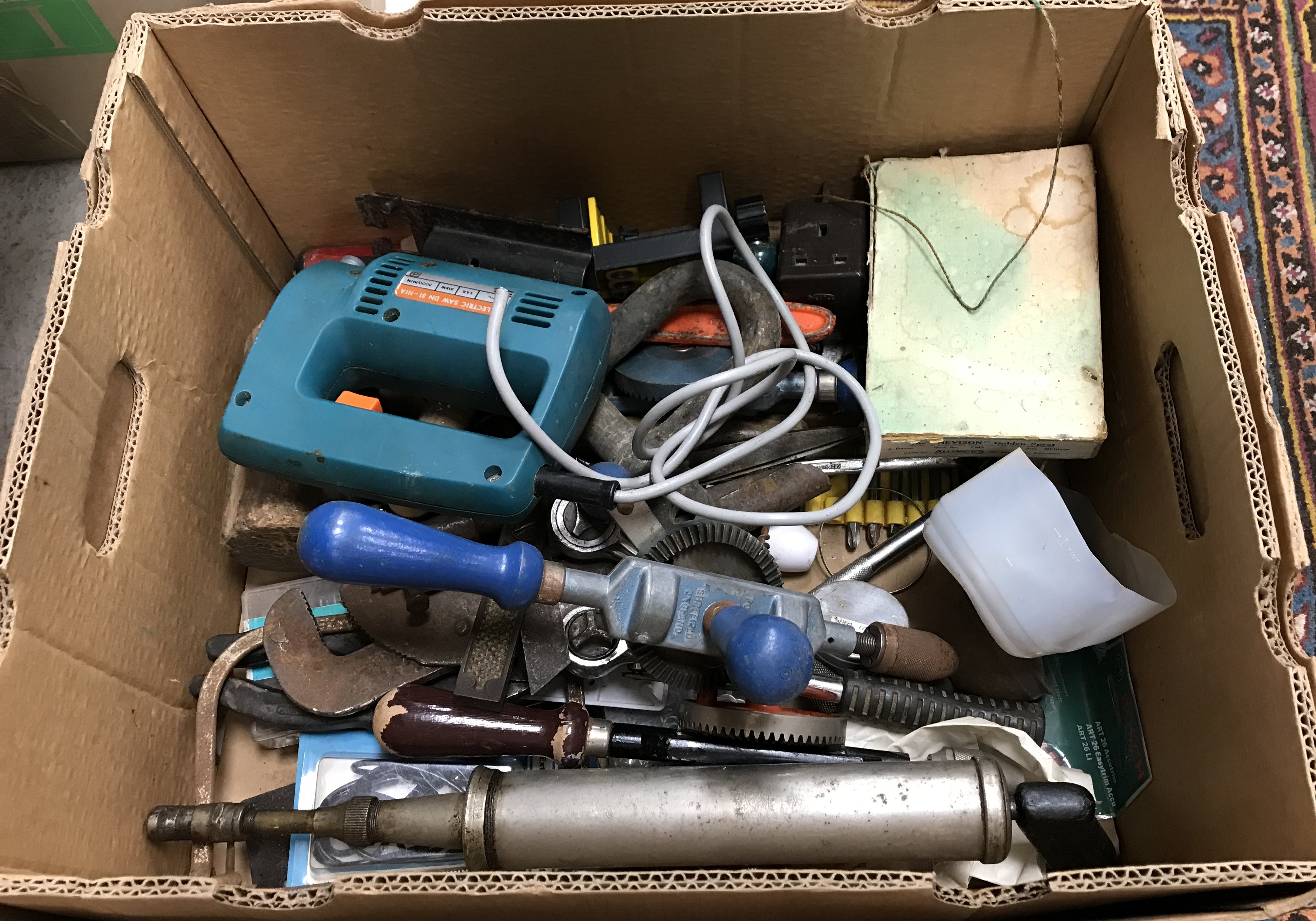 Two boxes of assorted hand tools to include trowels, planes,