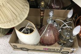 Two boxes of assorted lighting to include modern pink glass table lamps and various lamps made of