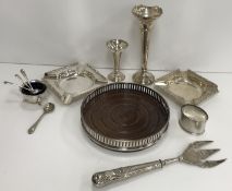 A collection of silver wares to include a modern silver mounted wine coaster of plain pierced form
