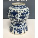 An 18th Century Delft blue and white baluster shaped jar,