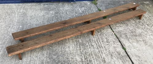 A pair of vintage pine church or chapel kneelers with single plank top on trestle supports 198.