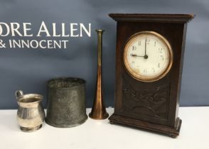 A wooden wine crate containing an early 20th Century oak cased mantel clock with dove and sunburst