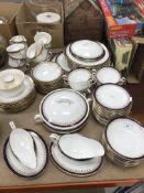 An Aynsley Leighton bone china dinner service comprising two oval serving plates, nine large plates,