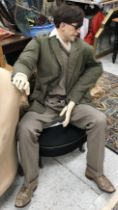 A vintage male mannequin in agricultural tweed jacket and brogues