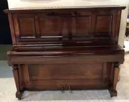 A mahogany cased upright piano, with ivory keys,