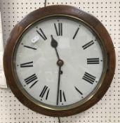 An oak cased wall dial clock, the white enamel dial set with Roman numerals,