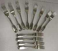 Twelve 19th Century silver "Fiddle" pattern table forks, various dates and makers, (29.