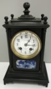 A late 19th Century JW Benson of London mantle clock with bronzed architectural case,