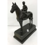 A patinated spelter figure of a "Mounted jockey", on a plinth base, 19.5 cm long x 23.