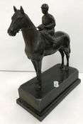 A patinated spelter figure of a "Mounted jockey", on a plinth base, 19.5 cm long x 23.