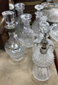 An Edwardian cut glass decanter of thistle form with silver mounts by the stopper with Jack Tar