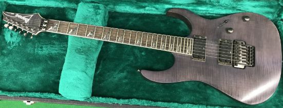 An Ibanez RG Series electric guitar, charcoal body, four pick ups, No'd.