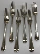 A set of five George III silver table forks plus one similar (by Thomas Dicks, London 1803),