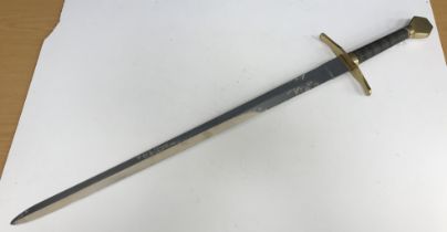 A modern replica Medieval sword with brass pommel, steel wirework grip and brass hilt,