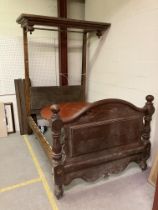 A Victorian pitch pine half tester bedstead 144 cm wide