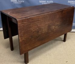 A George III mahogany rectangular drop leaf dining table on square moulded and chamfered supports,