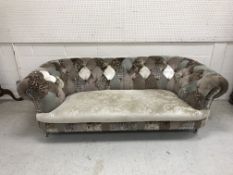 A modern patchwork buttoned upholstered Chesterfield sofa on silvered turned and reeded feet to
