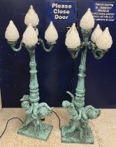 A pair of modern verdigris patinated bronze street lamp style lights with four branches and central