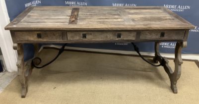 An Oka stained pine writing table in the 18th Century Spanish taste the plank top over three