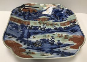 A 19th Century Chinese polychrome decorated dish decorated with lilies with gilt highlights 22.