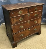 An 18th Century and later walnut and oak chest,