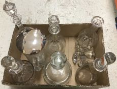 A box containing six various decanters, some with stoppers,
