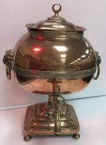 A 19th Century copper samovar with lion mask ring handles and brass tap 43 cm high,
