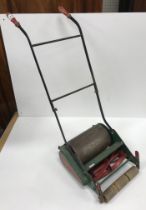 A vintage "The Web" small decorative lawnmower,