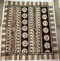 A Samoan stencilled bark Tapa cloth panel in brown and black,