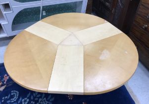 A Skovby of Denmark extending circular dining table on plain circular centre pedestal,