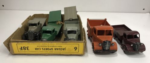 A collection of six various vintage Dinky flat bed lorries together with a similar Dinky Toys