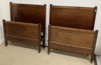 A pair of early 20th Century Heal's mahogany single bedsteads,