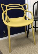 A Kartell Masters mustard chair designed by Philippe Starck & Eugeni Quitllet together with a Gemla