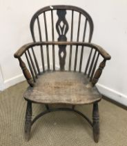 A 19th Century Thames Valley beech and ash stick back elbow chair on turned legs united by a