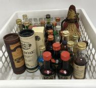 Thirty-one various spirit miniatures including Laphroaig malt whiskey, Glenfarclas malt whiskey,