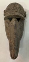 An African Burkina Faso Bobo carved treen ware baboon mask,